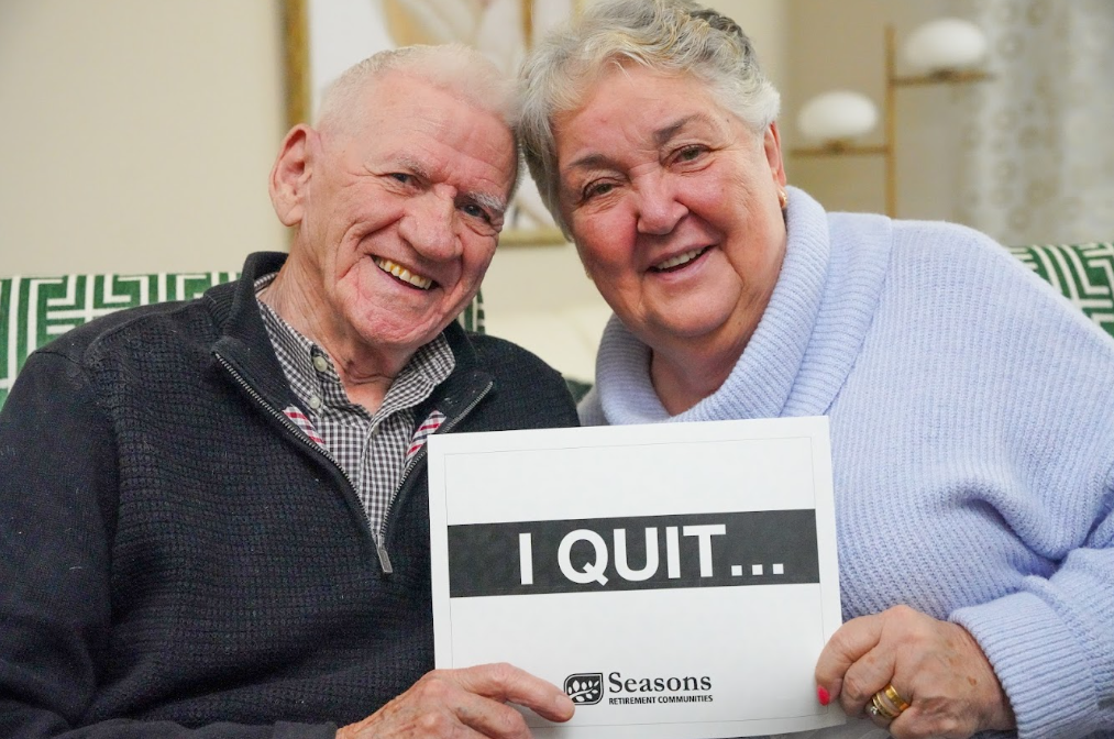 Two Seasons residents who participated in the I Quit campaign smiling while holding sign.