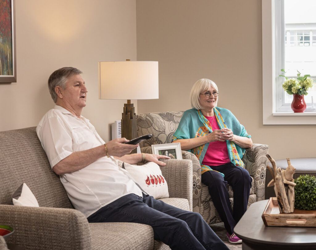 Residents watching television in their suite