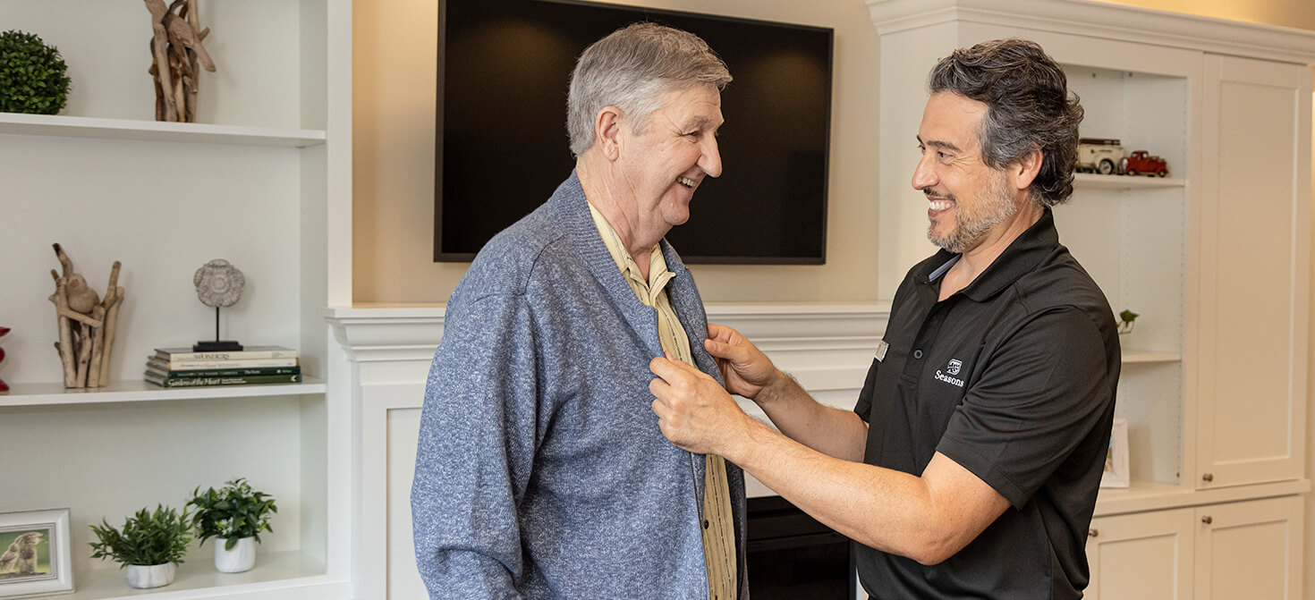 seasons care worker assisting resident
