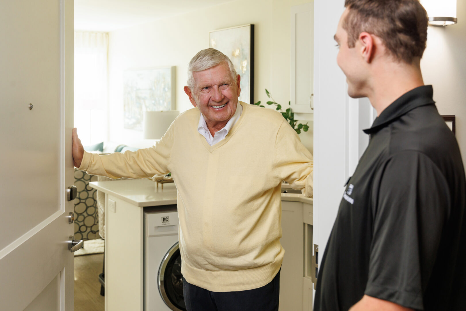 Seasons team member speaking with male resident